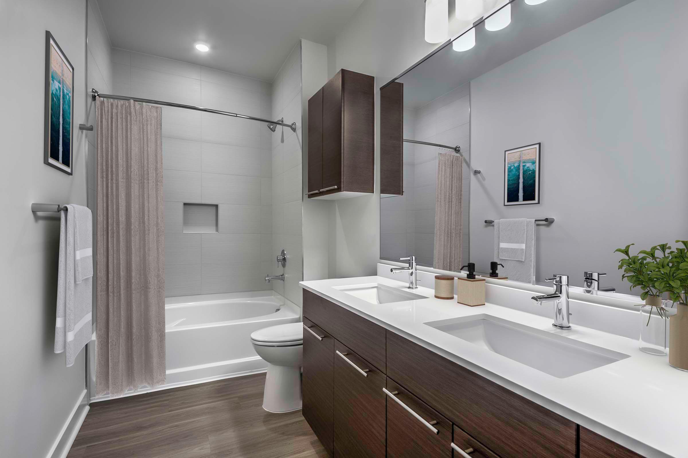 Bathroom with dual vanity sinks and soaking tub