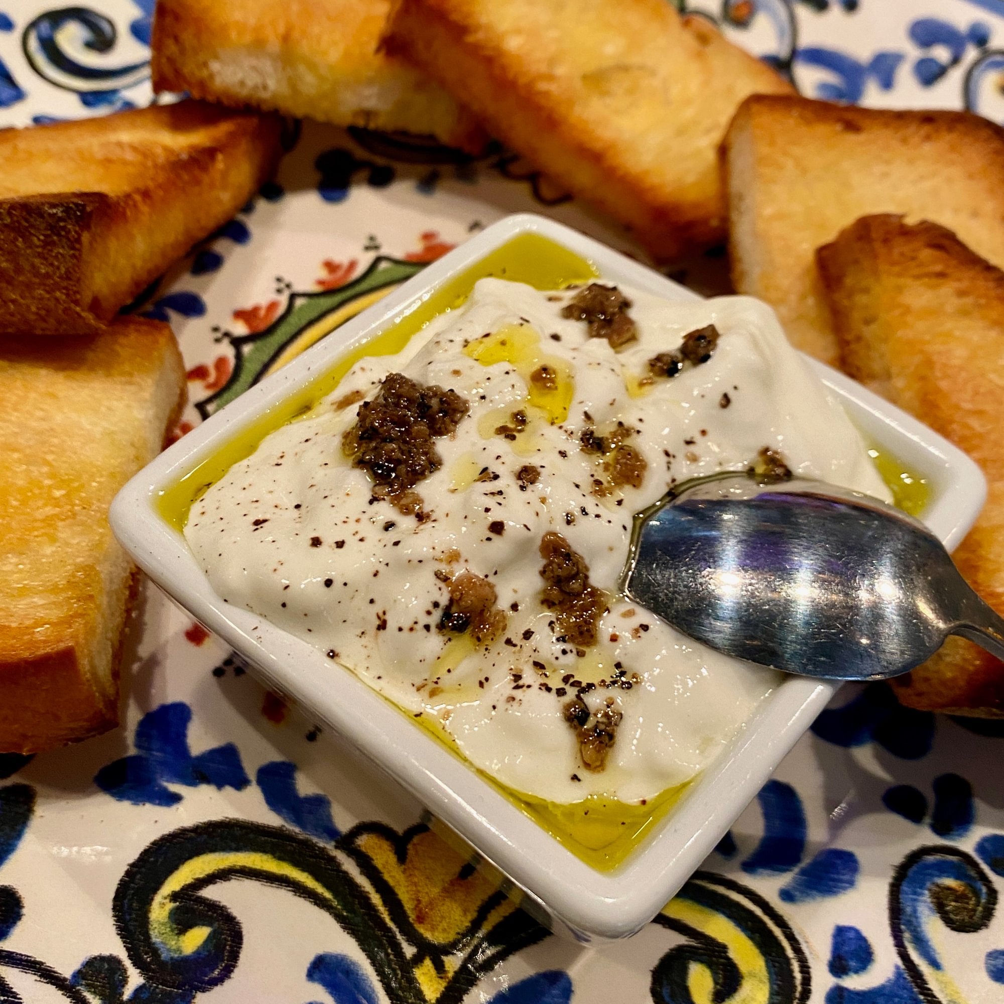 Stracciatella cheese dip, truffle carpaccio