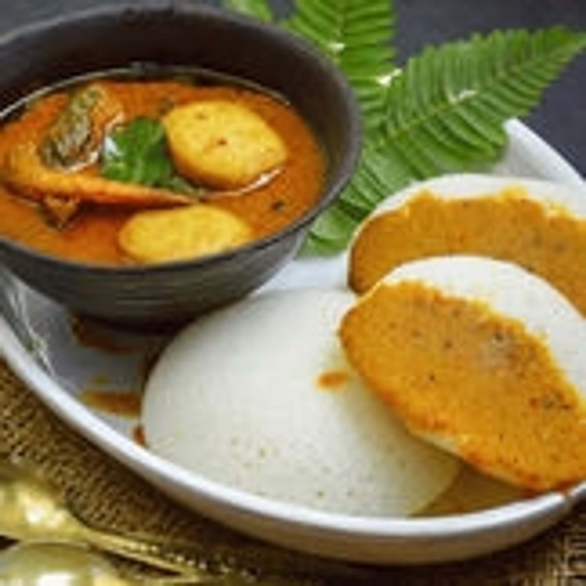 Idli with Fish Kulambu (Gravy)