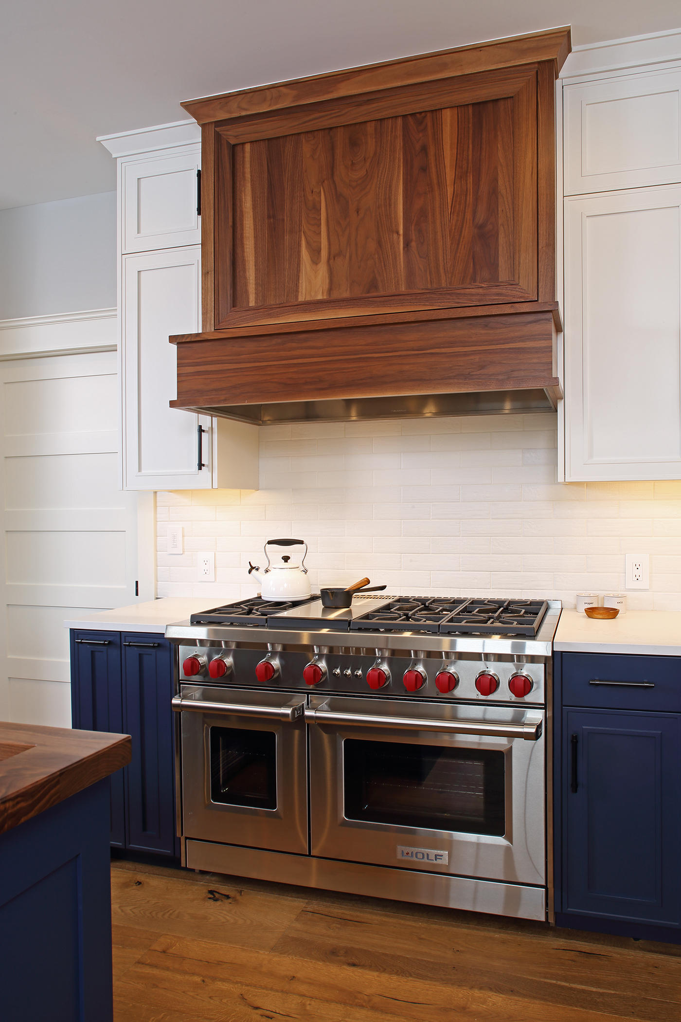 Executive kitchen blending cabinet finishes.