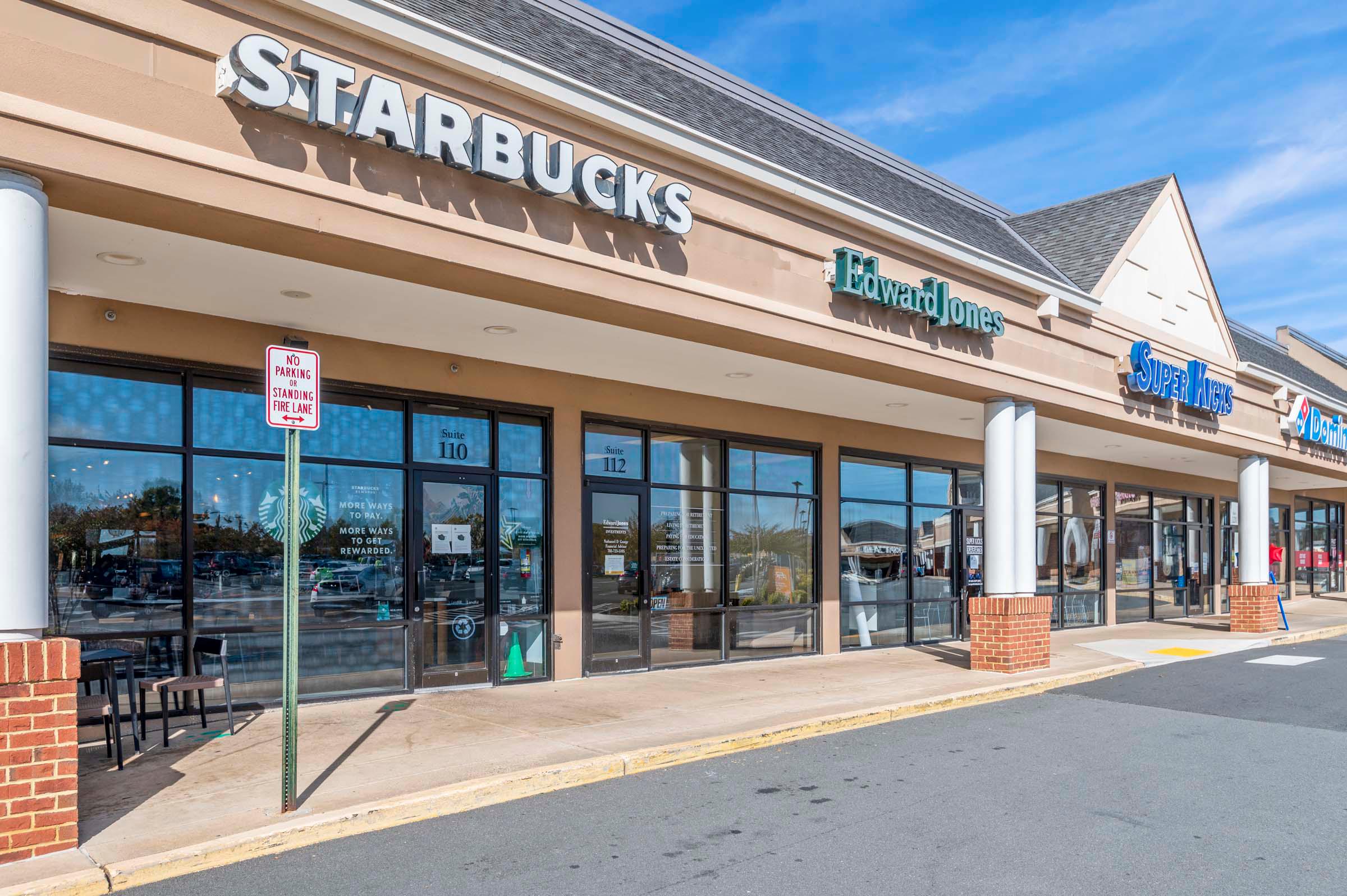 Shopping center with Starbucks coffee shop near Camden Ashburn Farm in Ashburn, Virginia