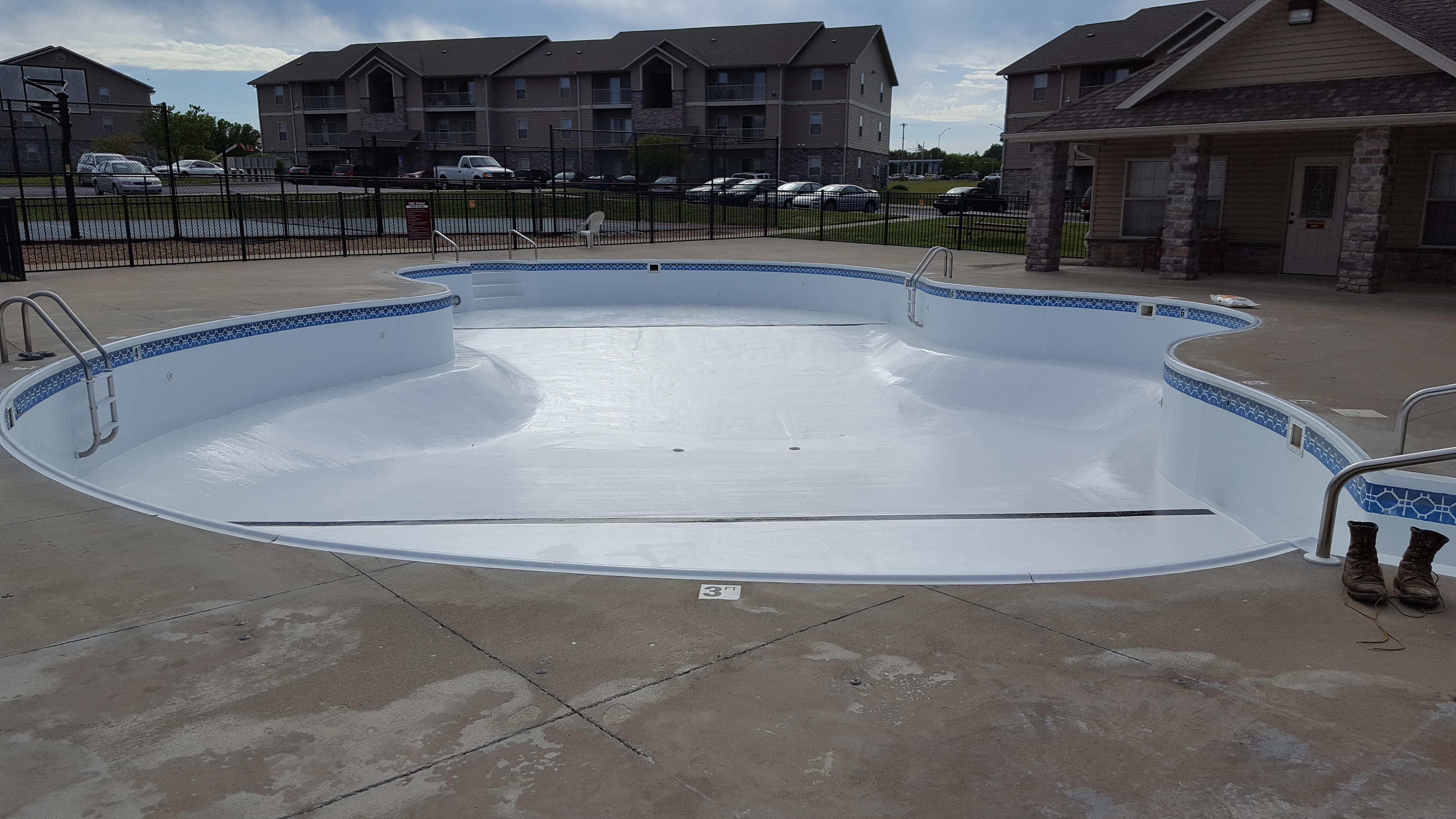 Rhodes Custom Pools Inc Logo