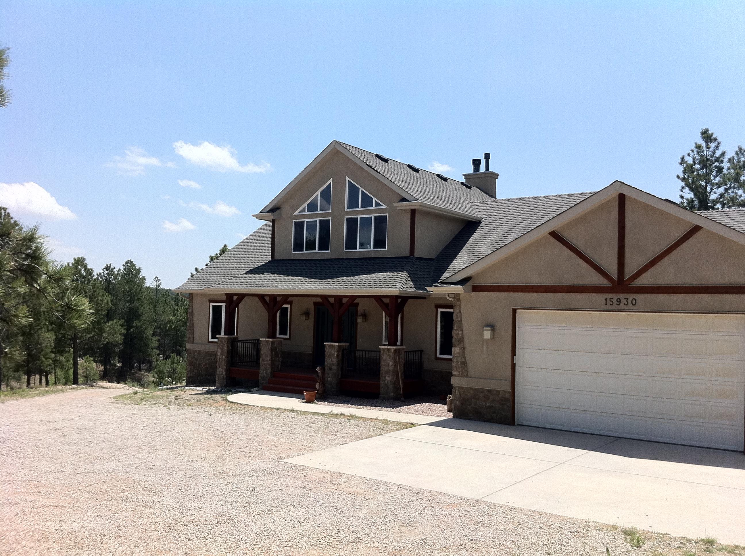 This is a gorgeous home with view, pine trees, land and close to the Air Force Academy and Discovery Canyon Schools.