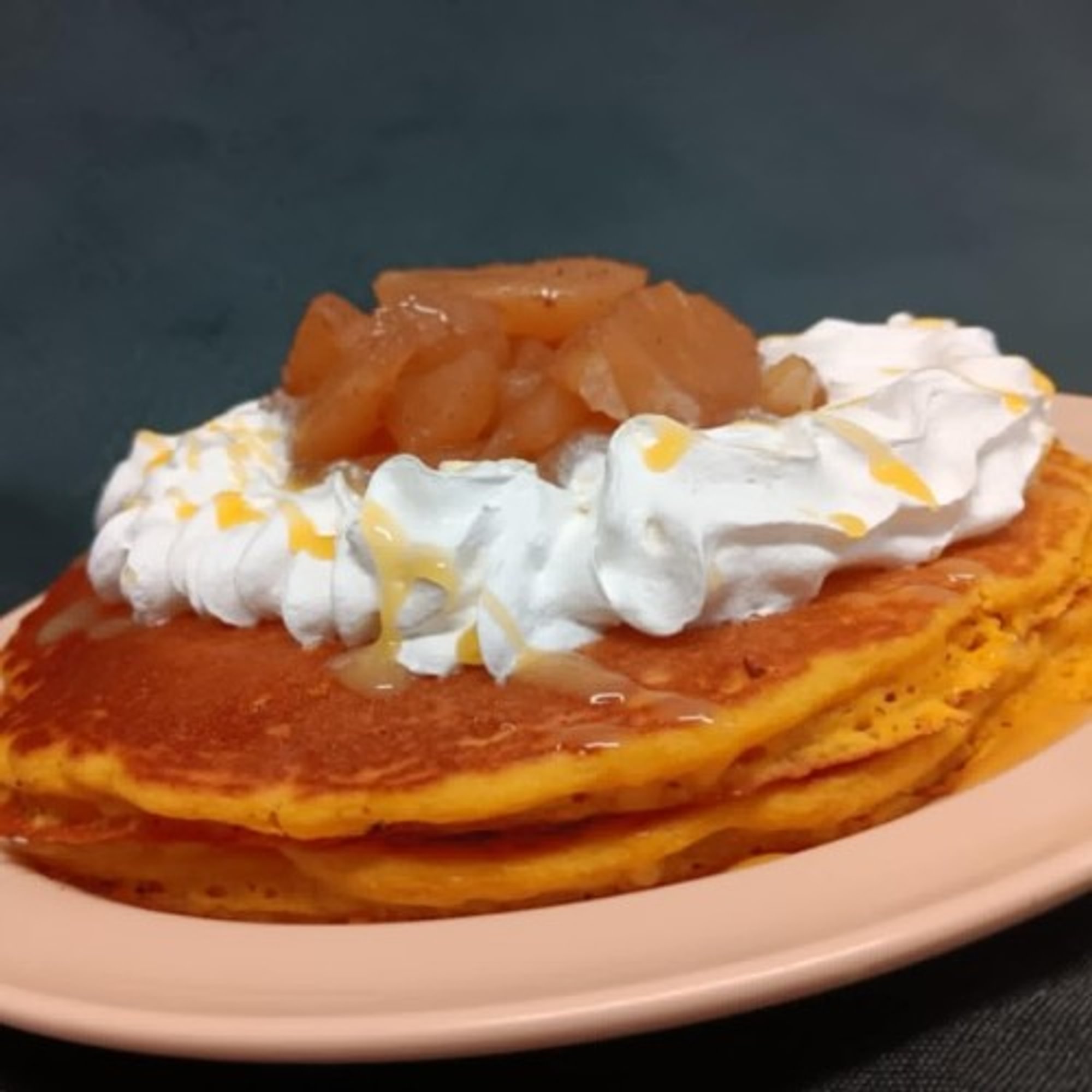 Two Hot Cakes with Apples and Whipped Cream
