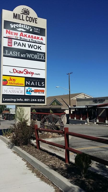 Angel Arms Massage is located in the LASH MY WORLD STUDIOS at the Cove Mill Shopping Center (sign is in the bottom left side rectangle in this picture, which is the Eastbound view).