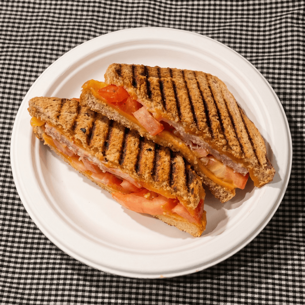Grilled Cheese with Ham Cheddar and Tomato on Whole Wheat Bread