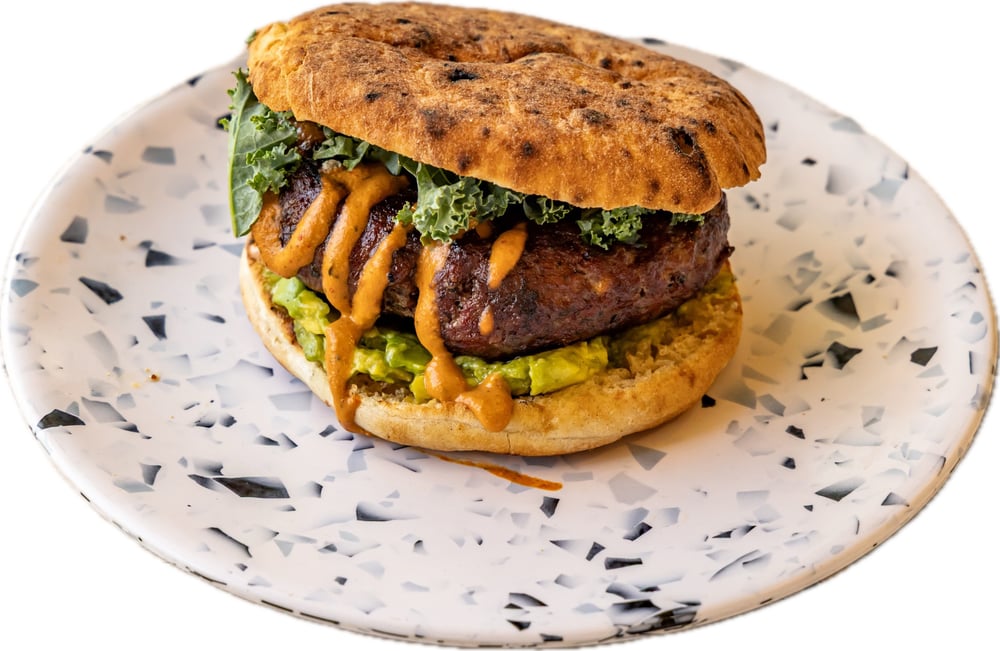 House Ground Chipotle Beef Burger, Avocado Hummus, Chipotle Tahini & Kale