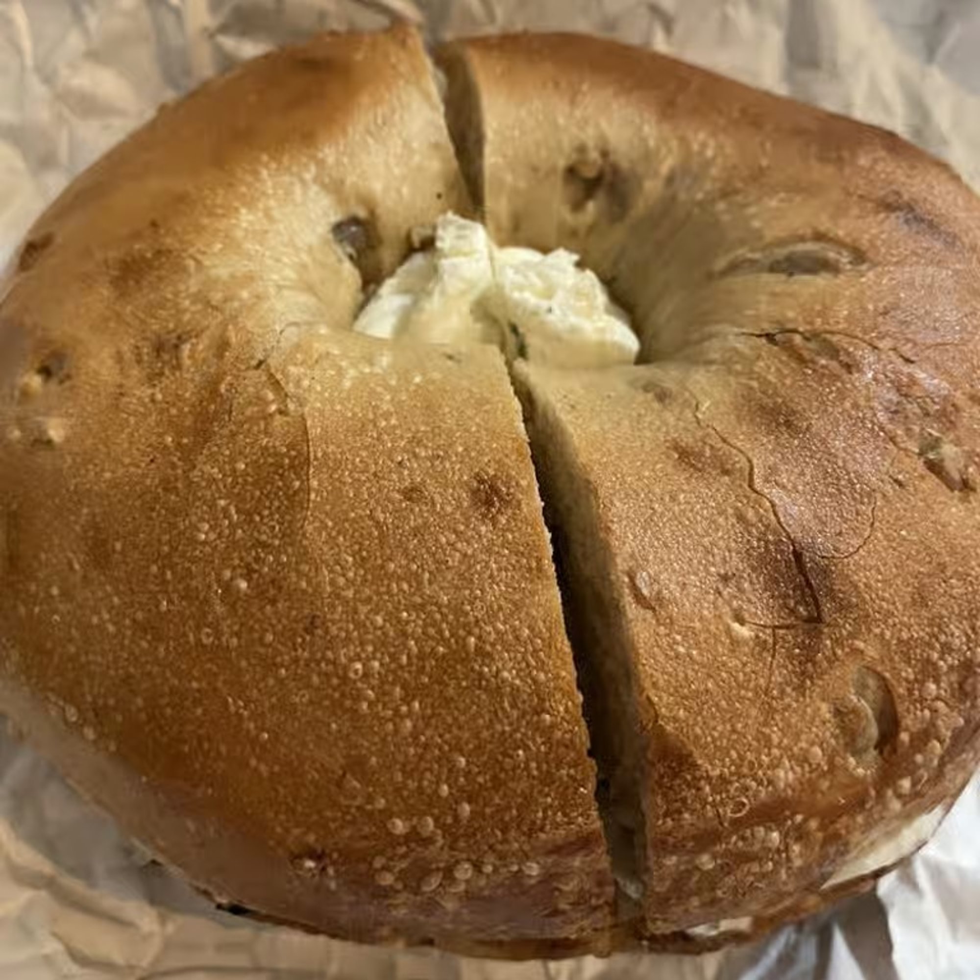 A bagel with Garlic & Herb spread