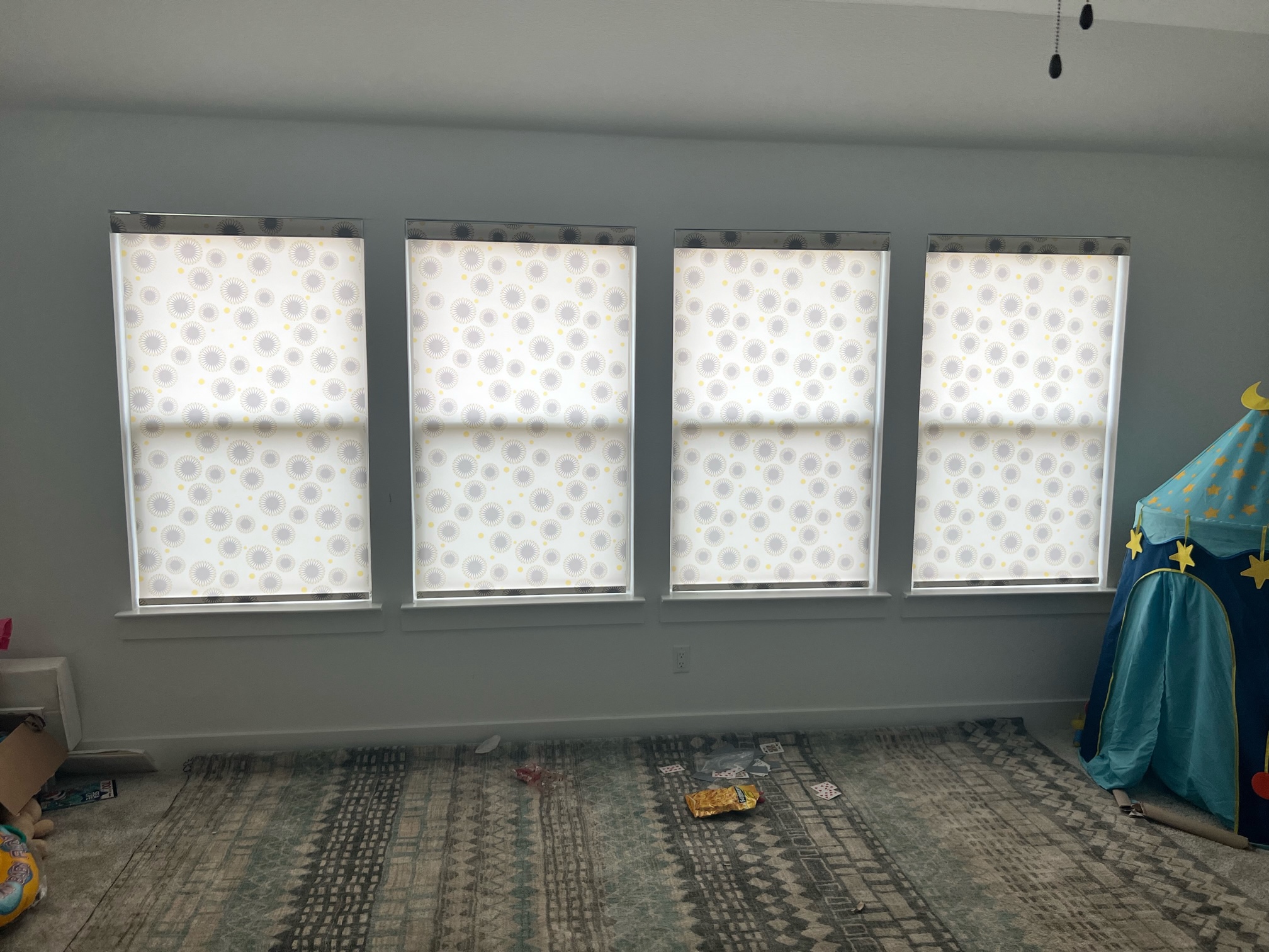 Light filtering patterned roller shade for play room in Leander