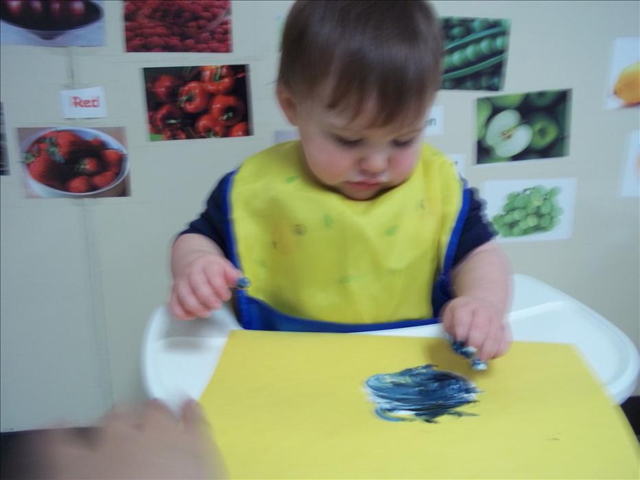 Our infants have plenty of opportunities to use creative expression while exploring various art materials such as finger paint.