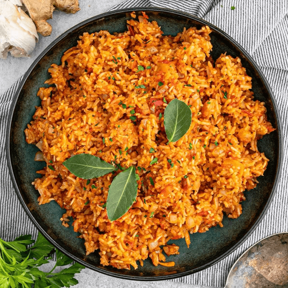 Jollof Rice With Baked Turkey Wings + Fried Plantains + Soda or Water