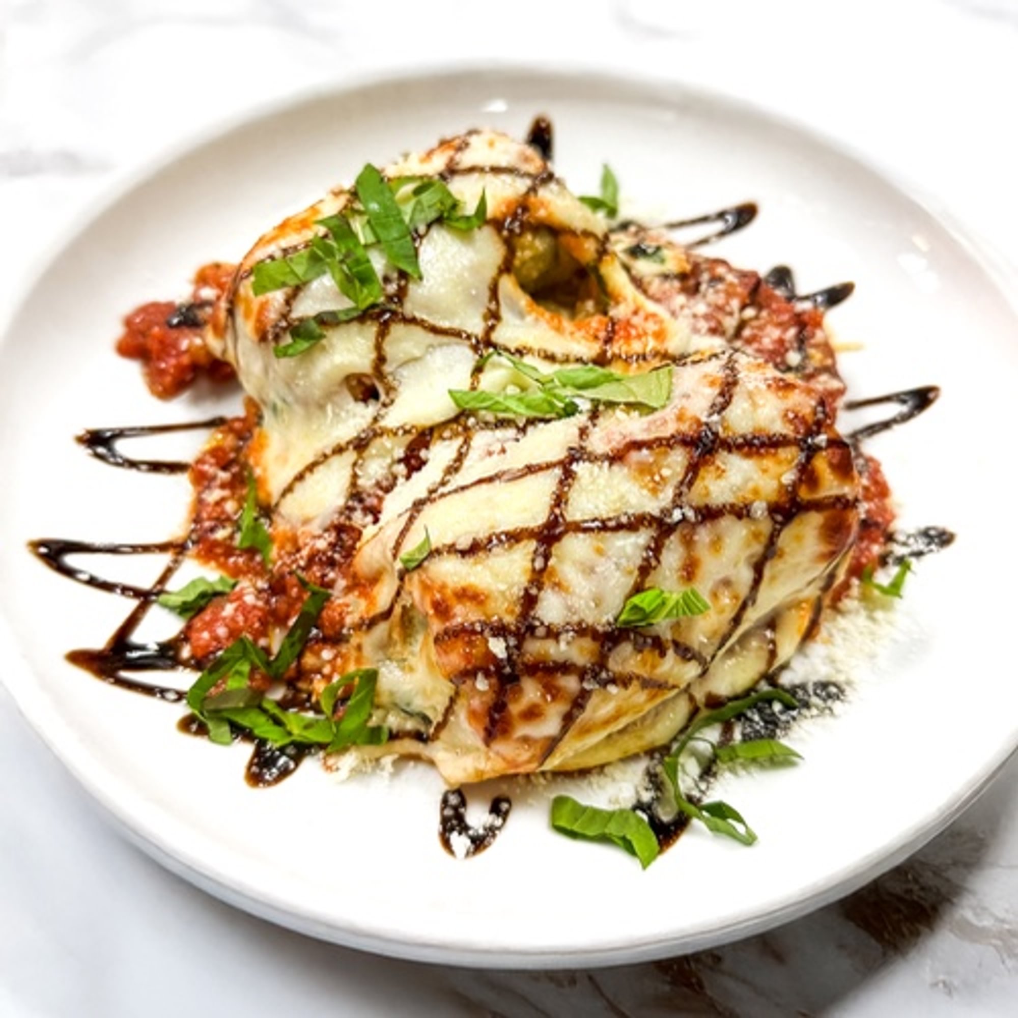 Rolled in Spinach, Ricotta, Mozzarella, Tomato Sauce over Angel Hair Pasta