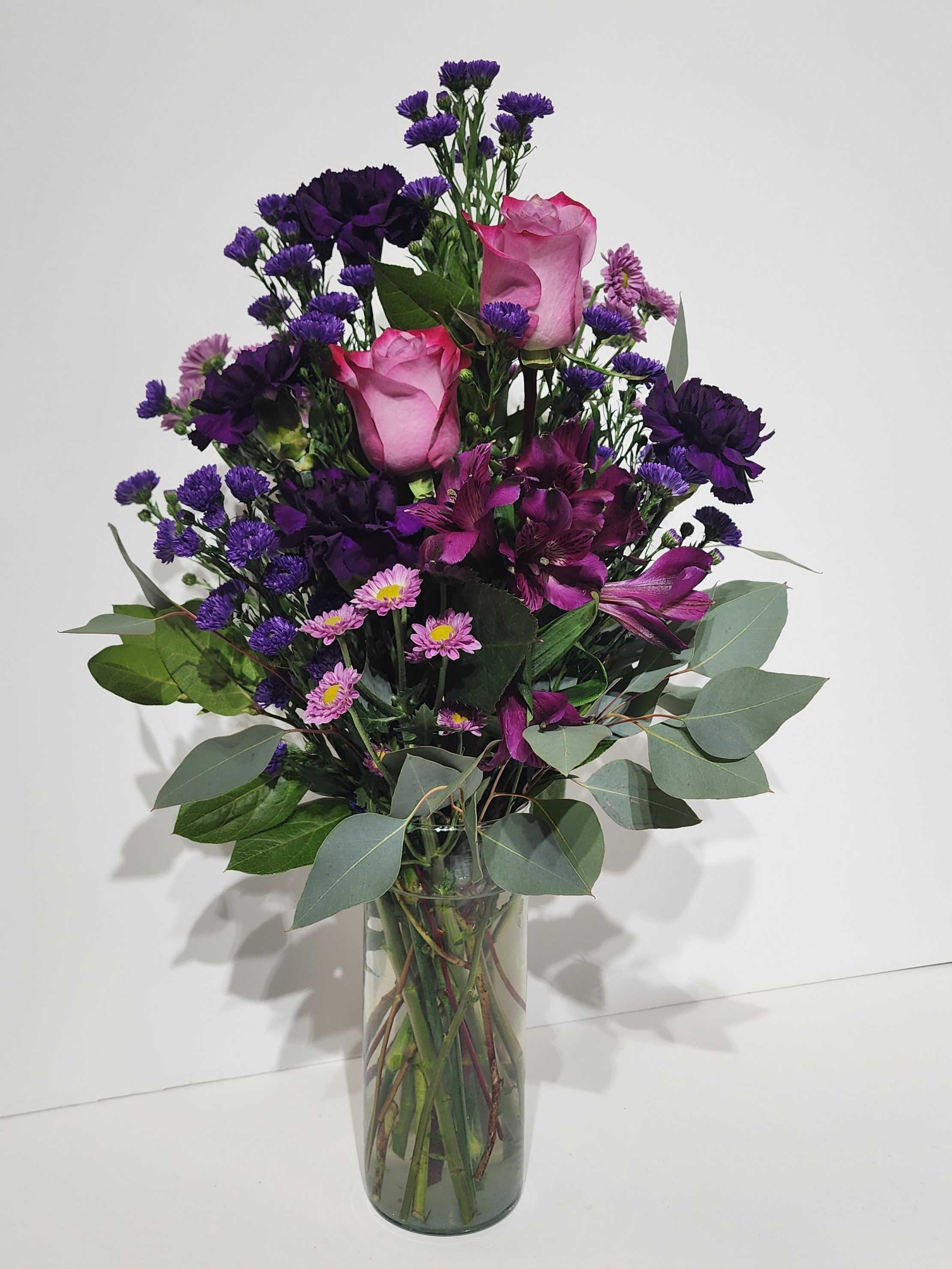 purple wildflower bouquet arrangement by Country Greenery at The Galleria