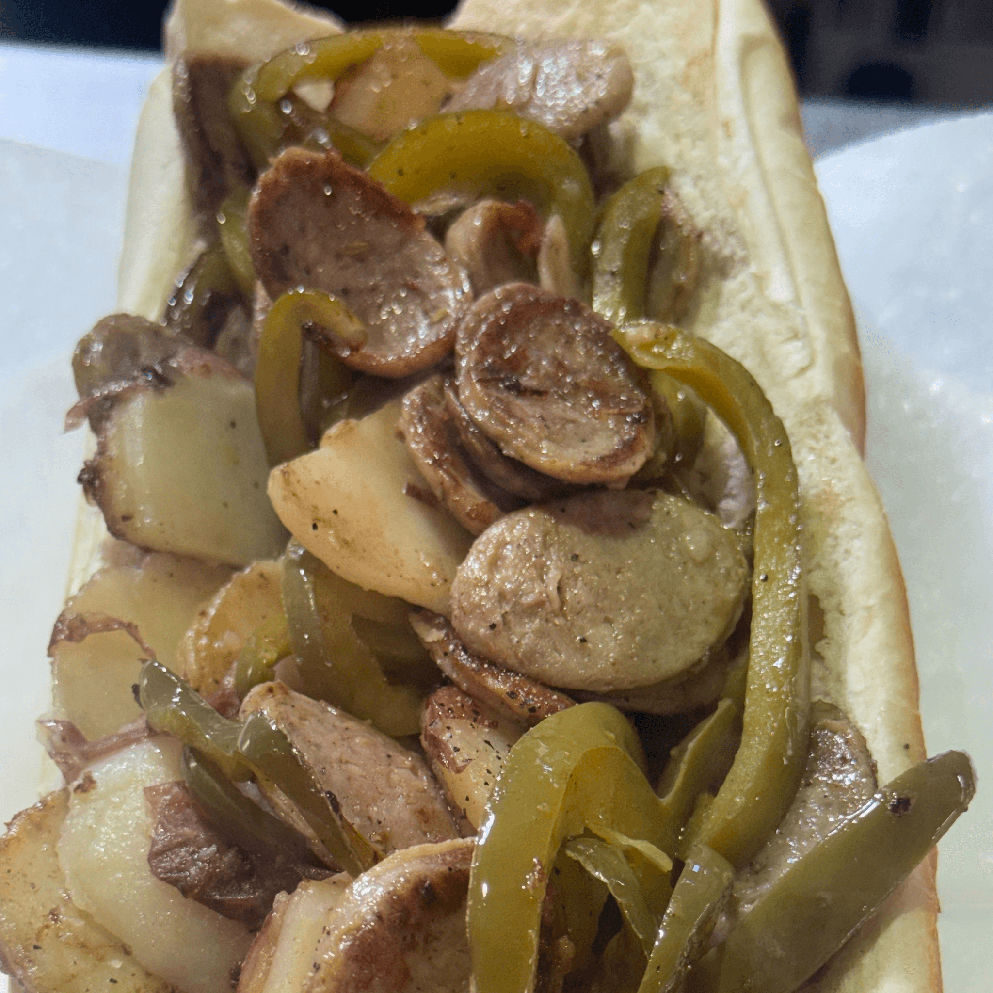 Italian Sausage with homemade vinegar peppers and sliced Red Bliss Potatoes sub