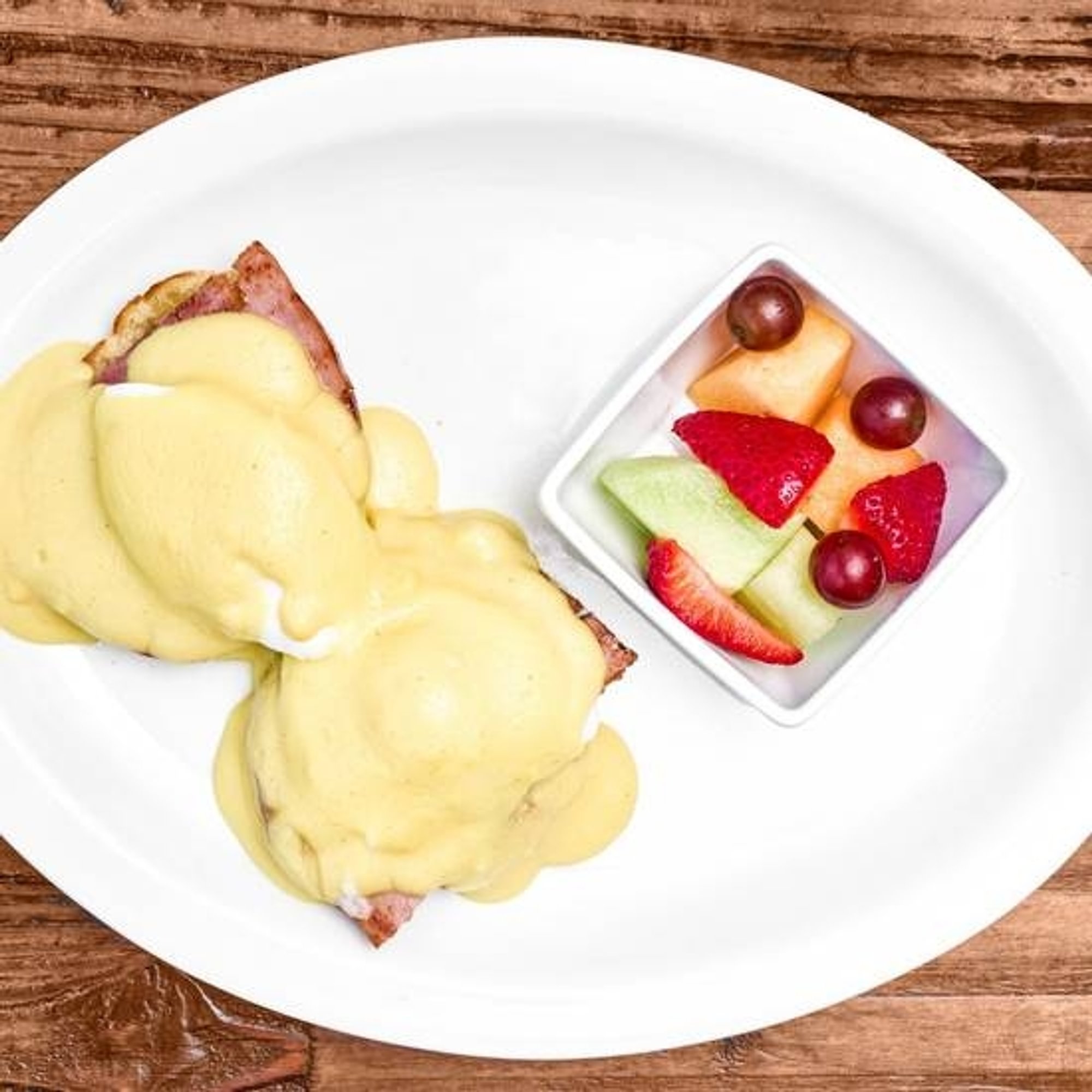 CORN BEEF HASH EGGS BENEDICT with FRUIT CUP
