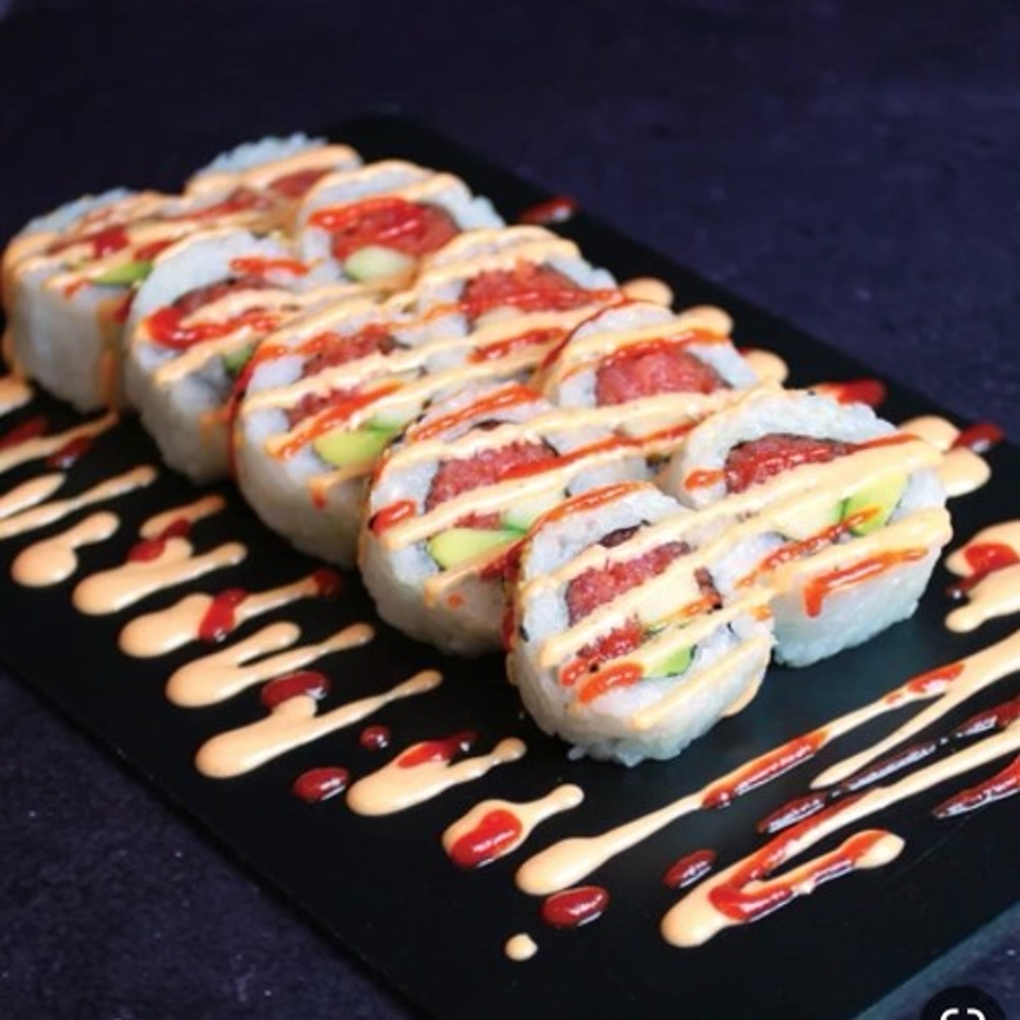 <Spicy Salmon Roll* $12