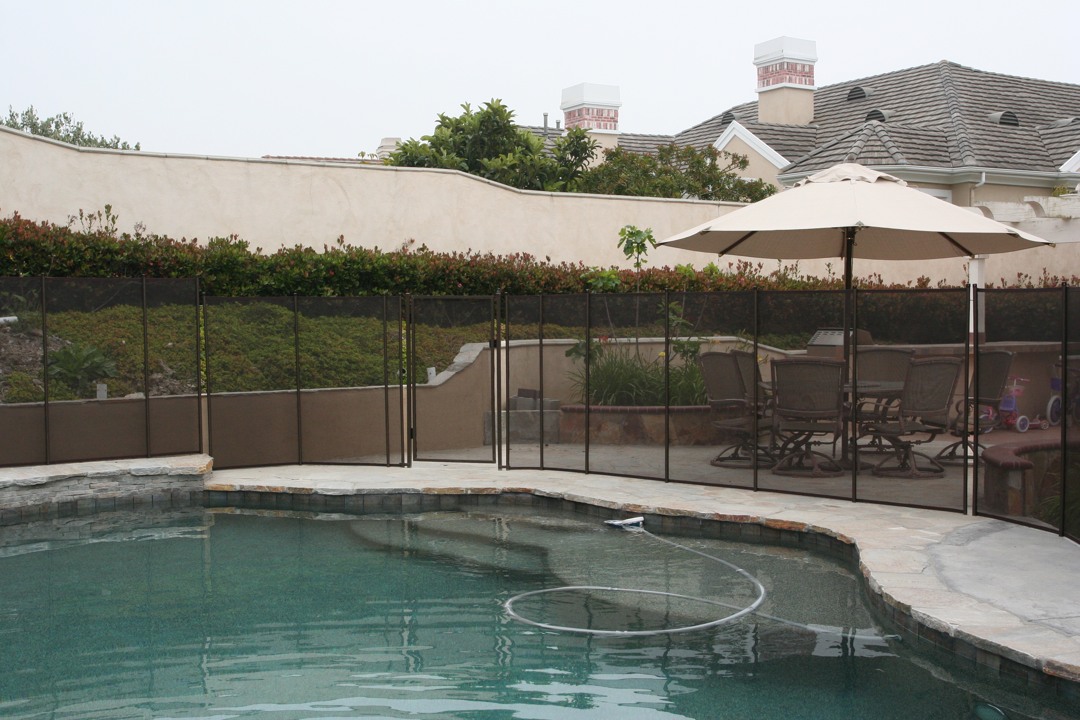 Katchakid removable pool safety fence in antique bronze.