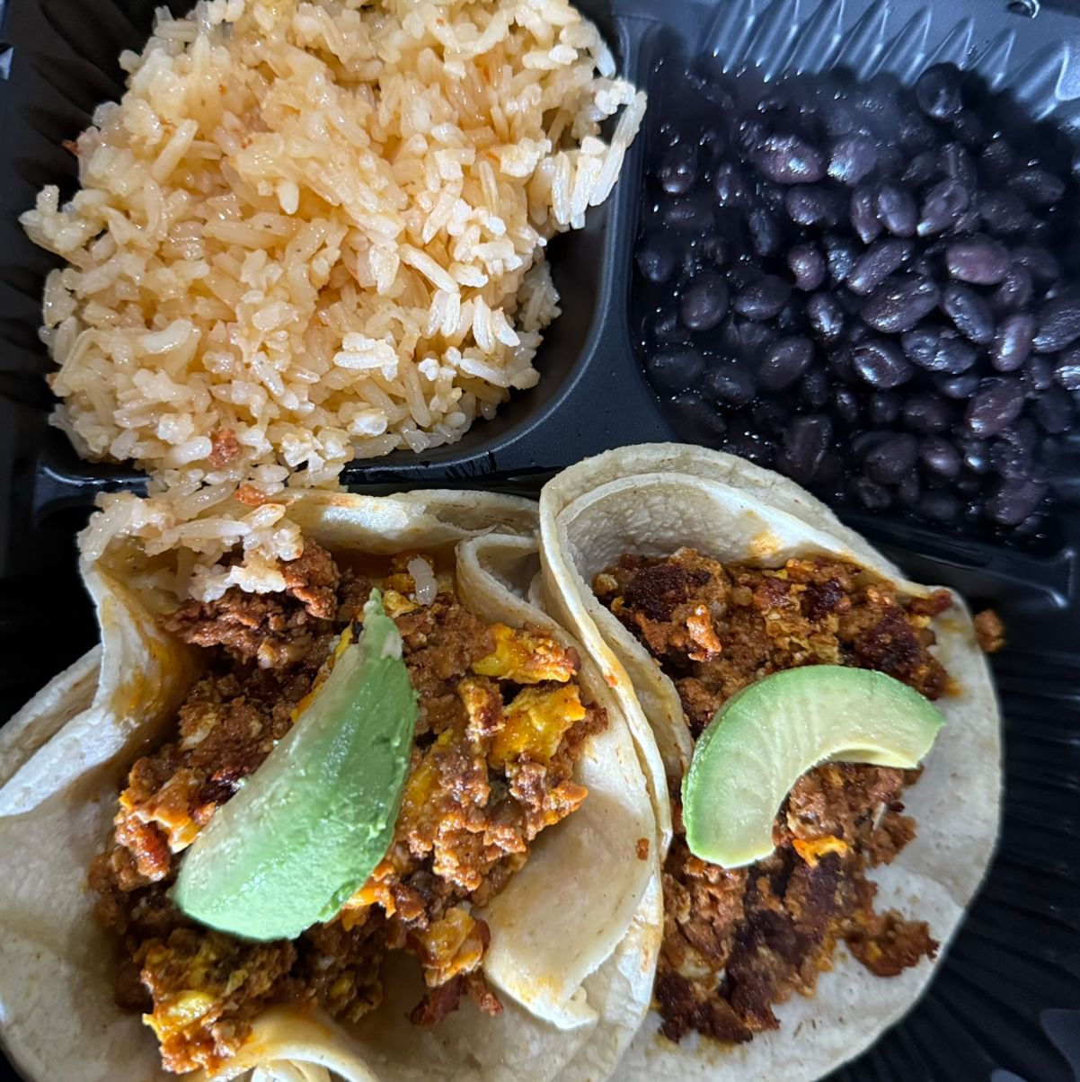 2 tacos egg w/ chorizo rice and beans