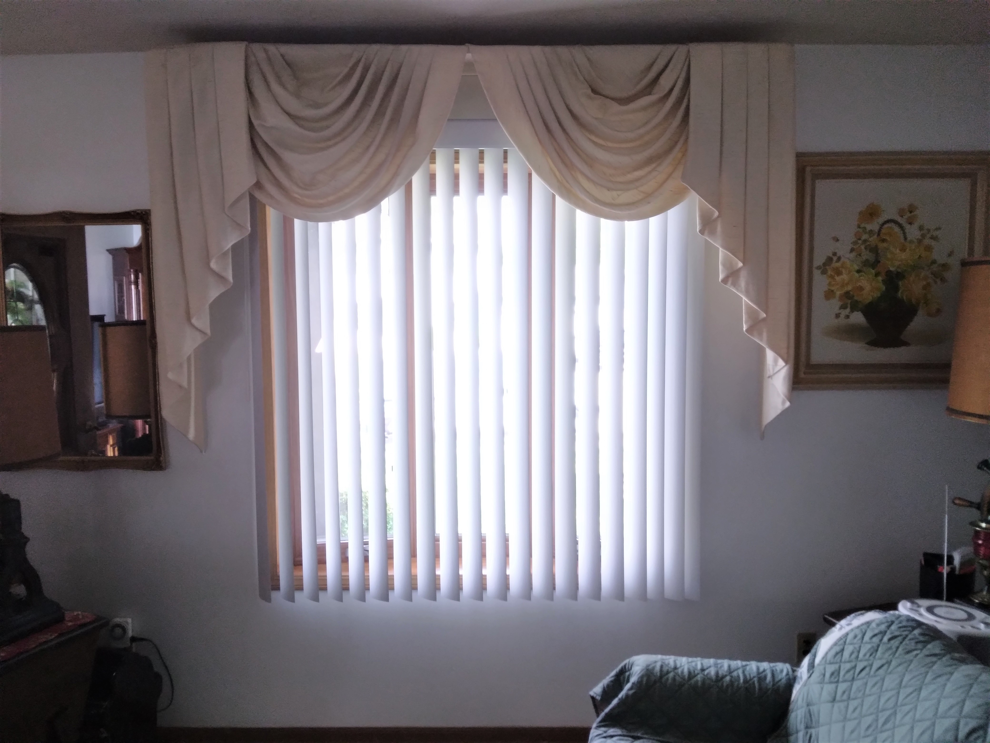 These vertical blinds in this Springfield Illinois living room provide a clean and fresh look.  BudgetBlinds  WindowCoverings  VerticalBlinds  Blinds  SpringfieldIllinois