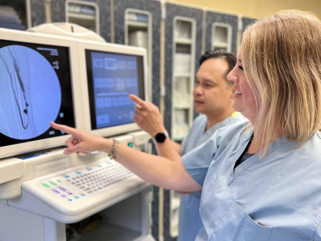 Staff members viewing patient images at Azura Vascular Care Woodland Park