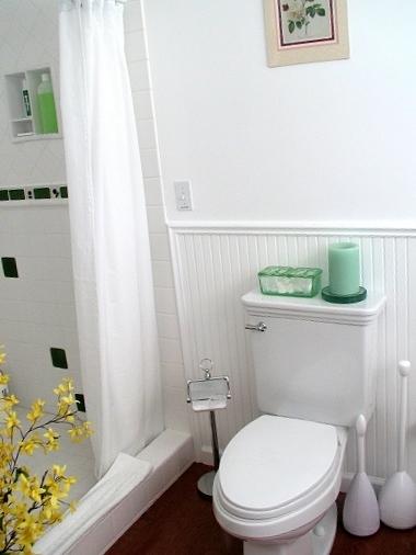 Vibrant green was used as a color accent in this bathroom. Including tile in the shower.