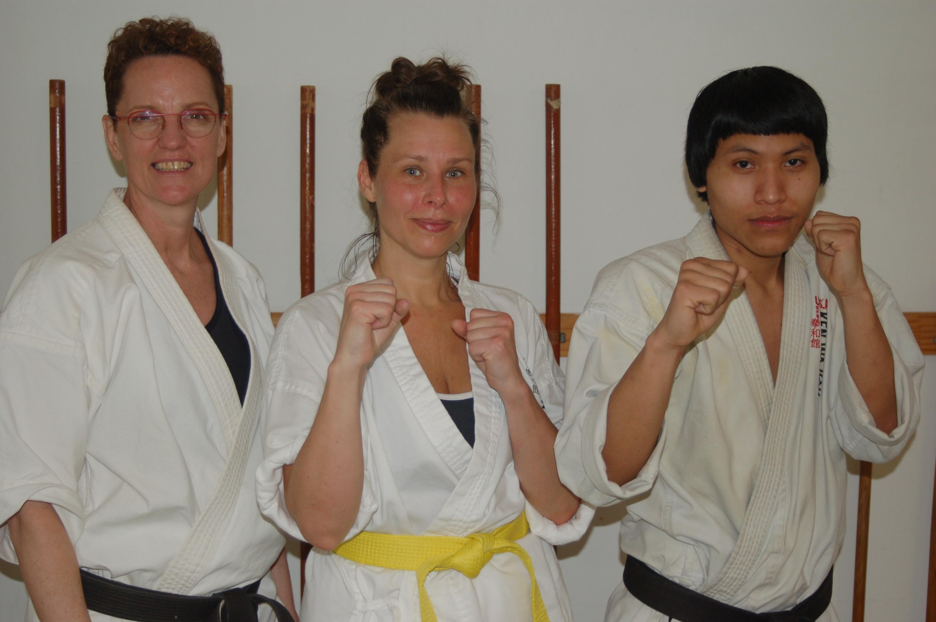 Kylin stands between Shihan Michelle and Sempai Augusto. 
