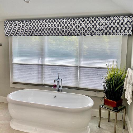 Who wants to soak in this fabulous tub? We added Hunter Douglas shades for privacy & light and topped this window off with a simple cornice. Call Budget Blinds for all your custom window treatments at 201-387-0050!  BudgetBlindsParamusWestwood  HunterDouglas  TriLightShades  CustomInspiredCornice
