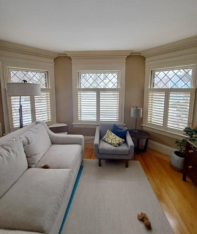Cafe shutters in this beautiful Bristol living room by Budget Blinds of Newport and Warwick.