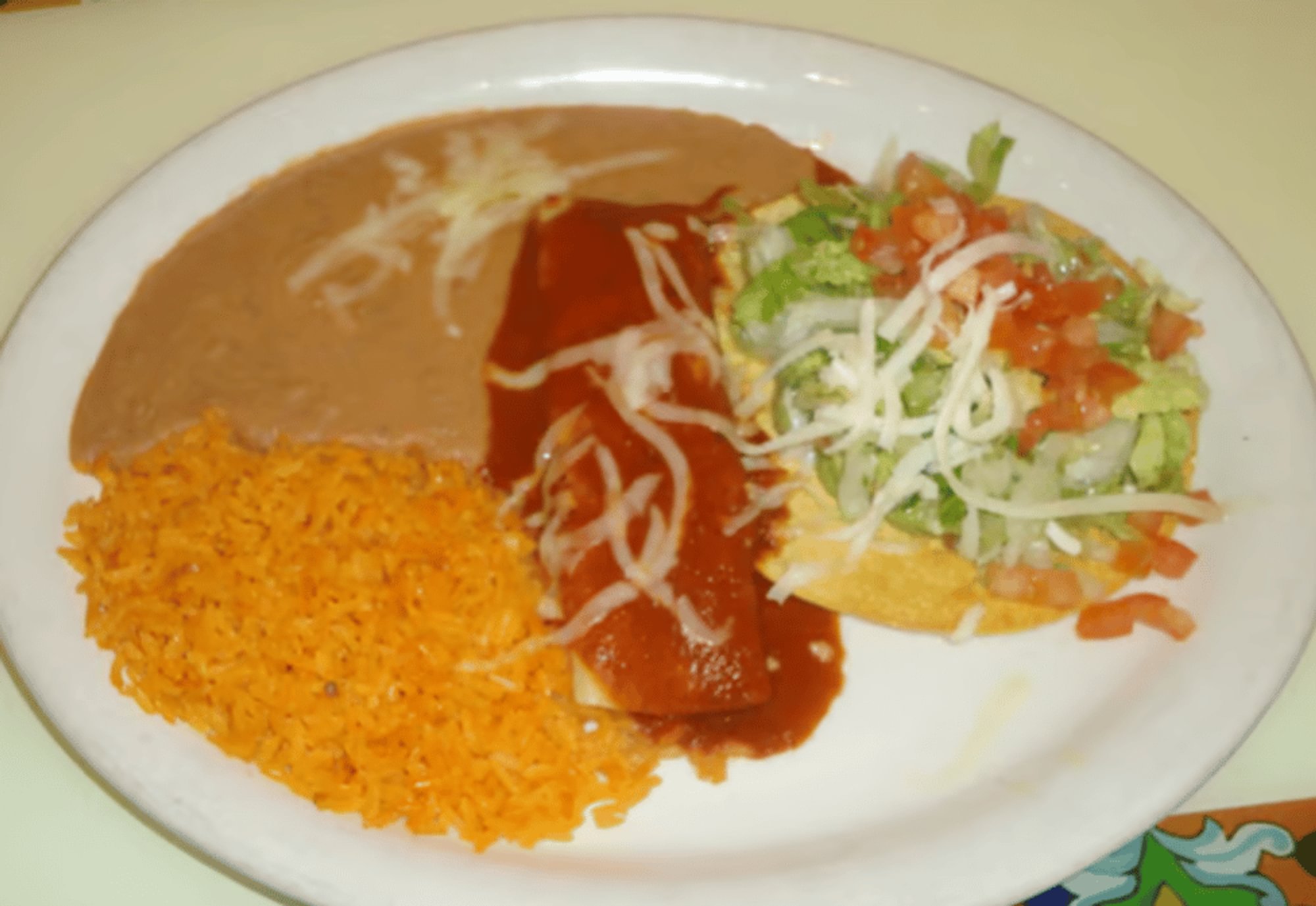 H. One Guacamole Tostada & One Beef Enchilada