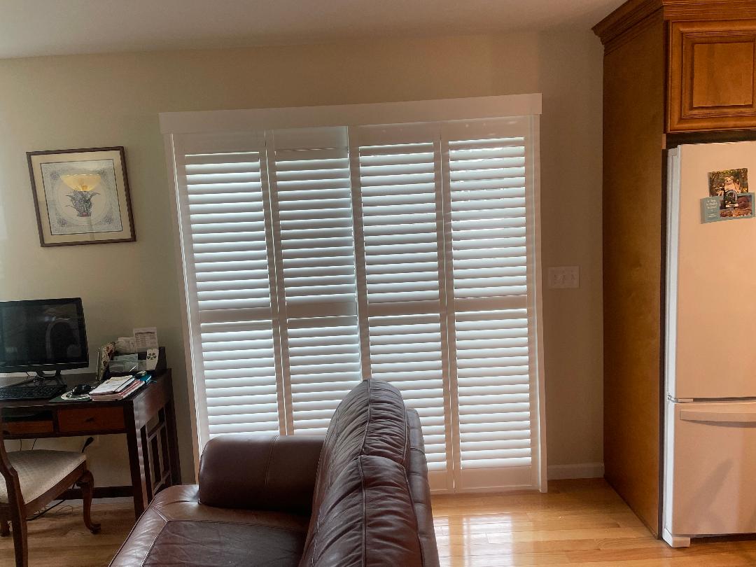 Bypass Norman shutters covering a sliding door. Call us for all your shutter needs. (570) 561-1550