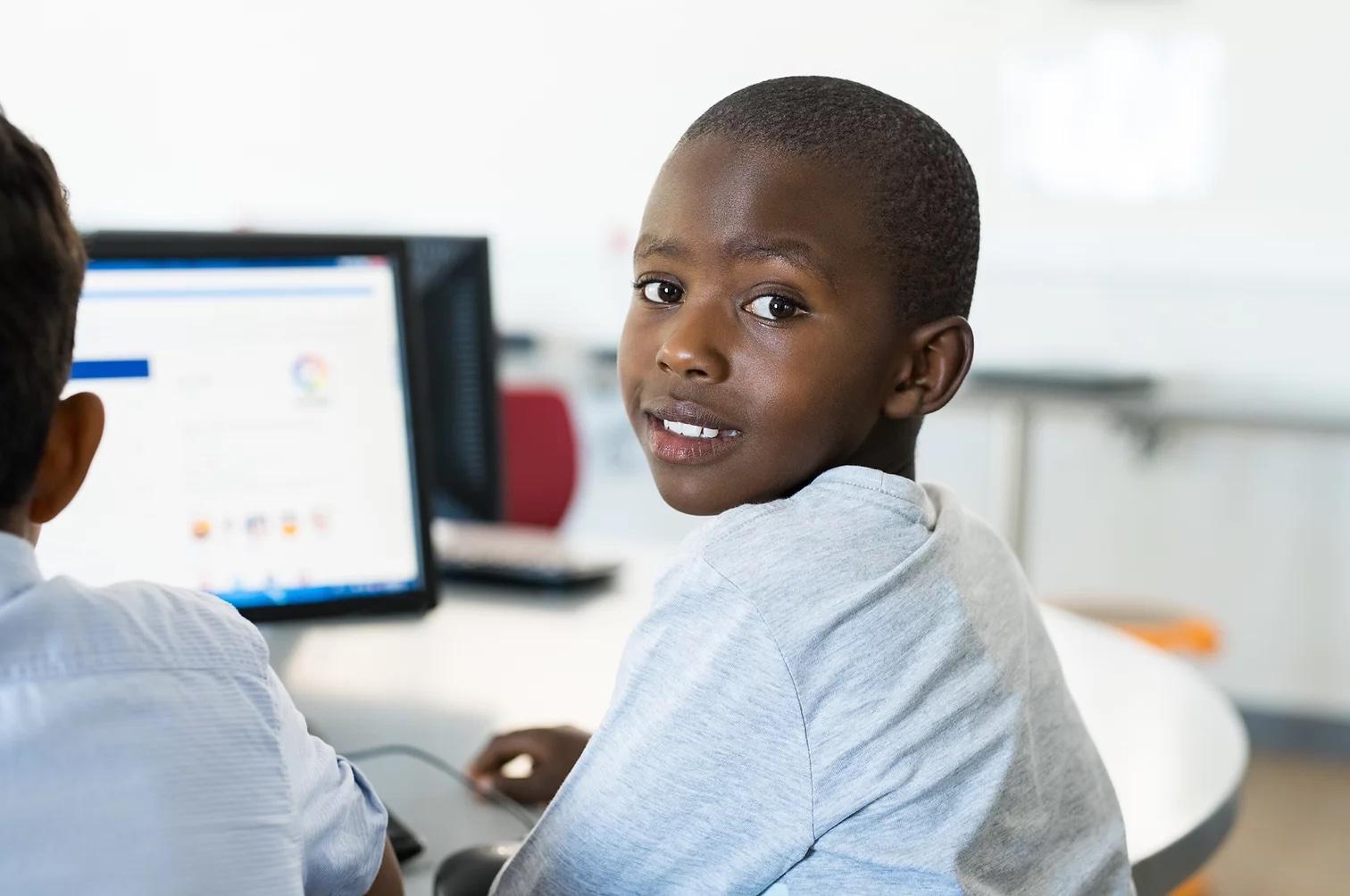 Male Student learning in computer class