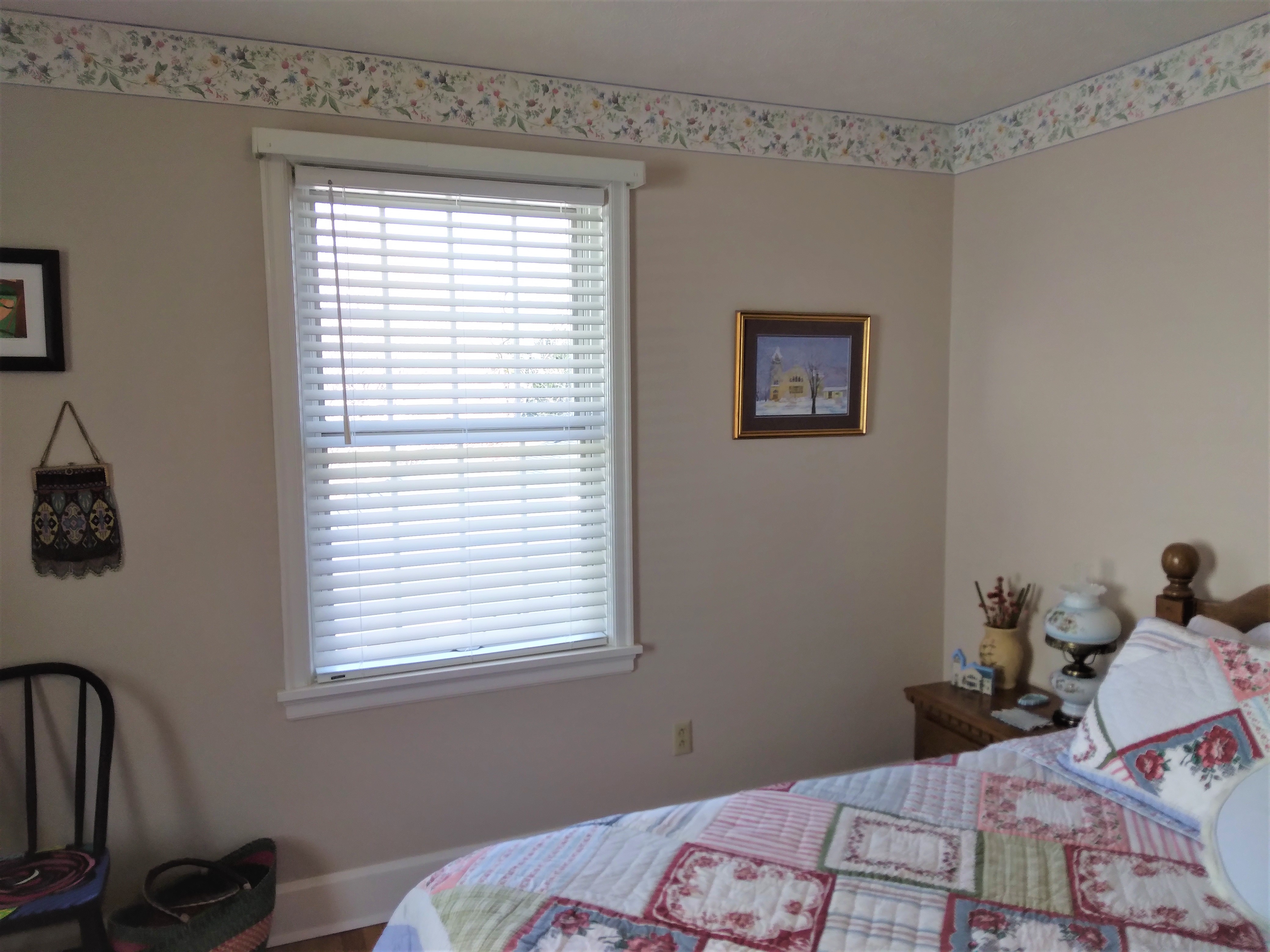 White faux wood blinds are a classic for a reason. They are a perfect window covering solution in almost any room.  BudgetBlinds  Window Coverings  Blinds  SpringfieldIllinois