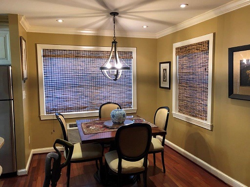 Woven Wood Roman Shades add warmth to this Alexandria Dining Area