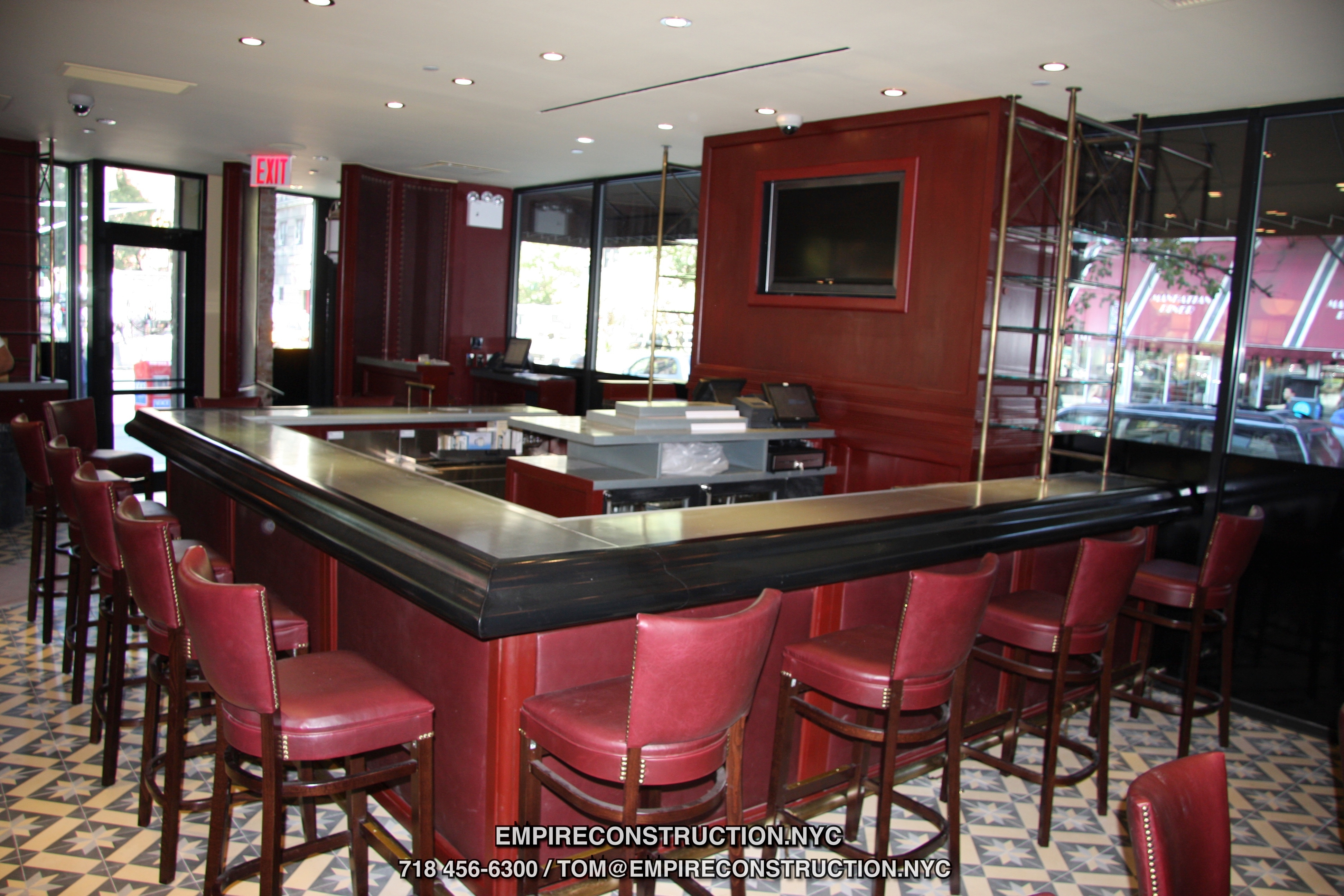 We do custom bars,  furniture and cabinets, maitre D stands, waiter stations, wine storages, custom commercial kitchens, decorative columns, vestiubles, shelves, racks, tables, chairs, storage closets, build ins, paneling, countertops, lighting design, low voltage wirening,  register and computer station set up, video security and fire alarms, wall and floor structures and any other elements that go into bar and restaurant building. 