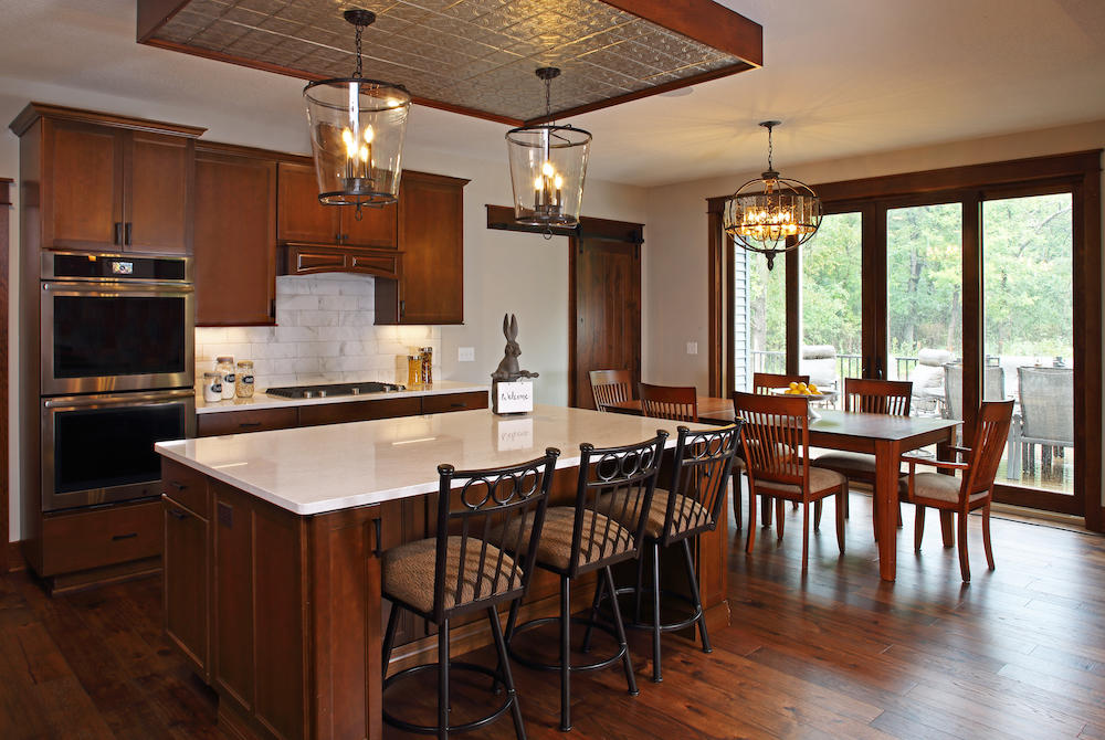 Custom Kitchen with rich cherry wood cabinets and white granite countertops