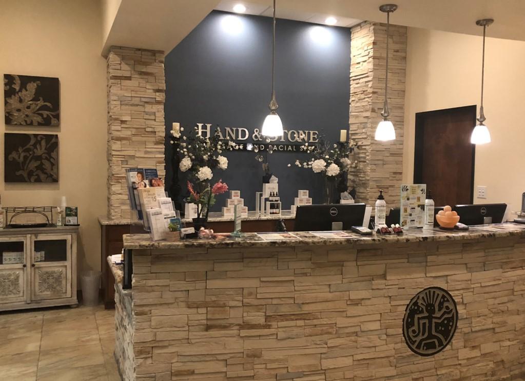 Hand and Stone Massage and Facial Spa Logo