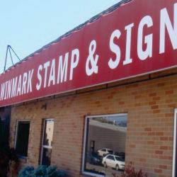 Winmark Stamp & Sign Photo