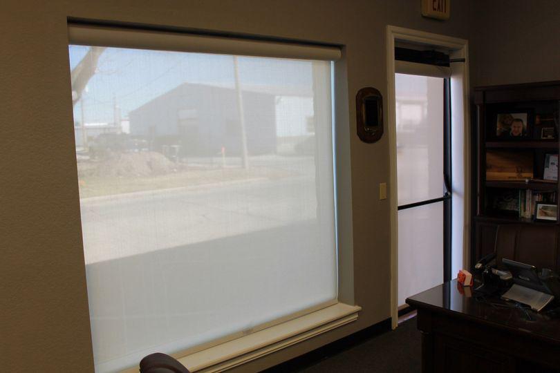 Take the edge off of big windows by installing Solar Shades like the ones in this office in Claremore, OK. The warm color adds a soft tone to this office - breaking up the light and allowing the user to control the privacy and sun glare!  BudgetBlindsOwasso  ClaremoreOK  SolarShades  CommercialShade