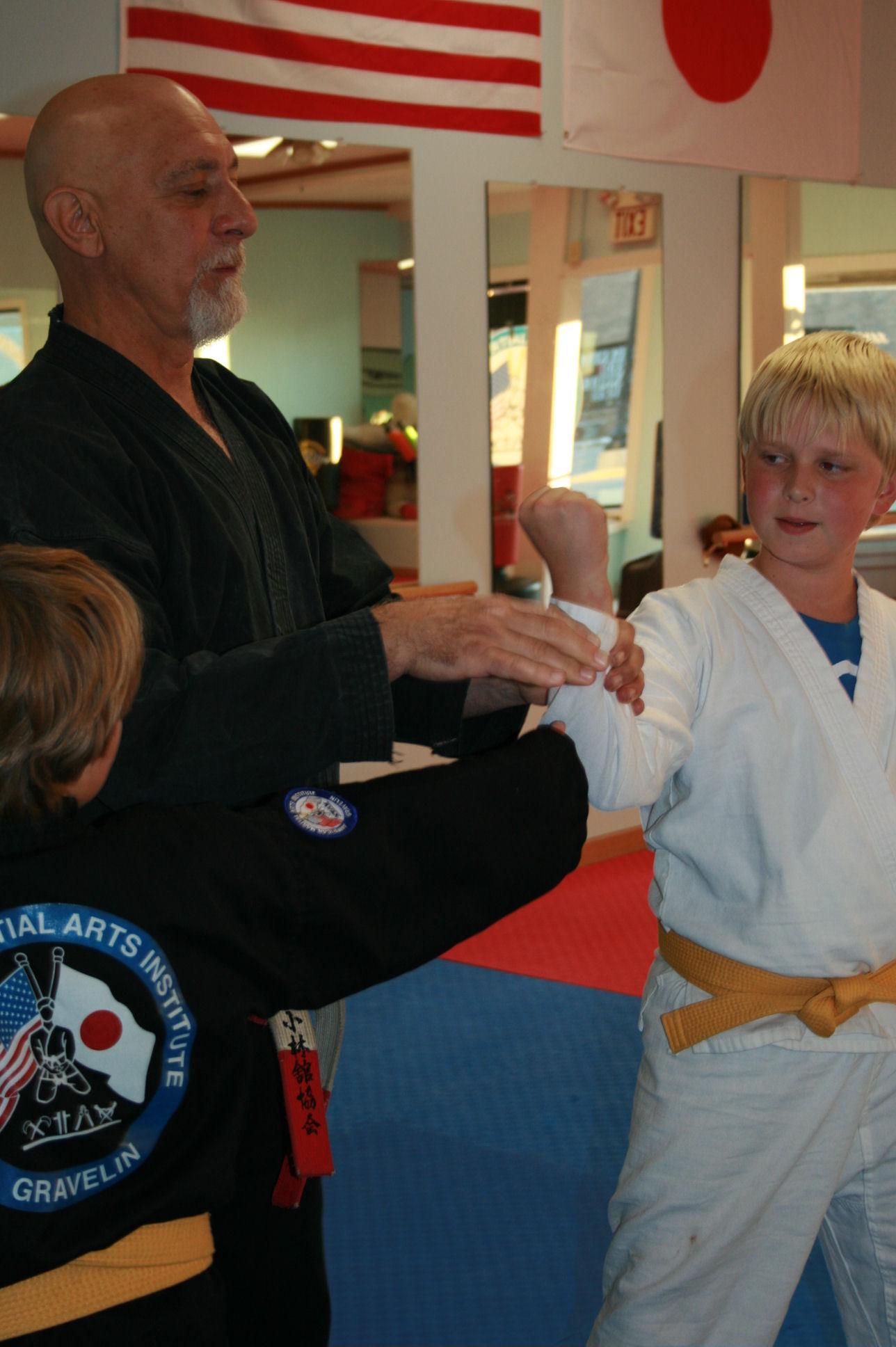 Kyoshi Terry Gravelin working with Juniors on the training floor