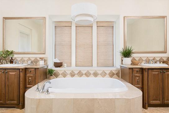 This bathroom features a beautiful mix of textures in matching shades-including our Motorized Woven Shades, which you can open and close with the press of a button!