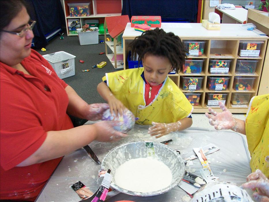The Pre Kinderarten class was knee deep in a paper mache project for the Dinosaur unit.
