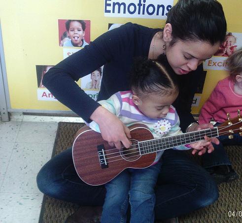 Here you can see our Discovery Preschool teacher teaching our children all about the Banjo! Miss Marilex enjoys playing the Banjo in her spare time and takes pride in incorporating this multicultural musical instrument into the children's classroom curriculum!