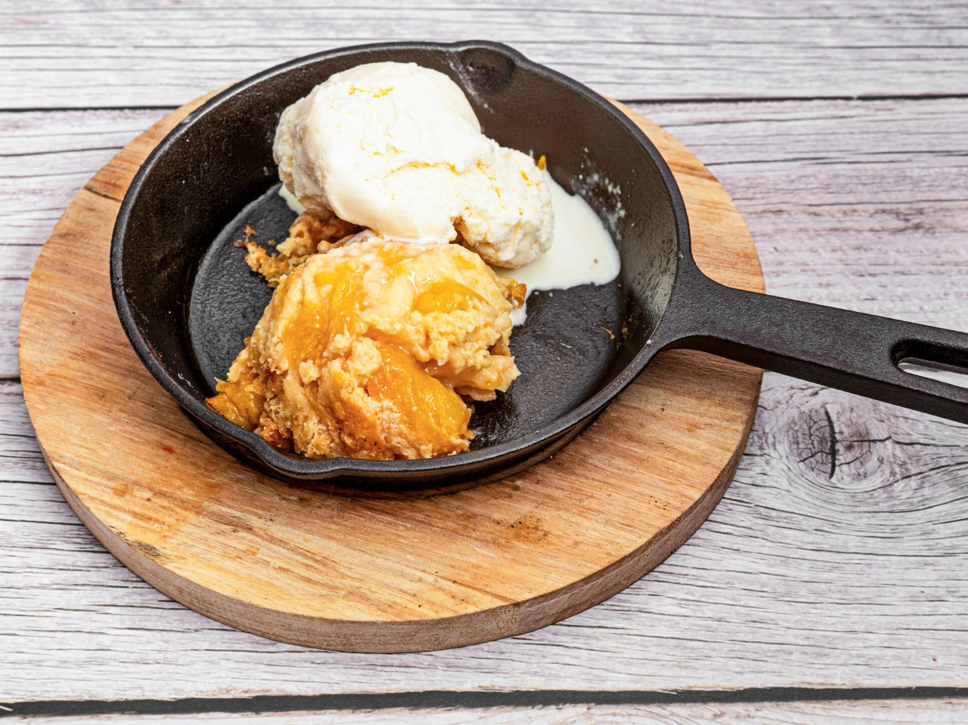 Peach Cobbler With Butter Rum Sauce & Ice Cream