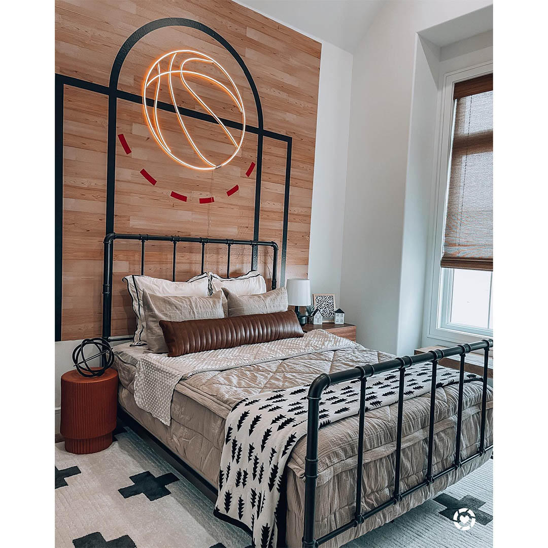 May all your swishes come true! This basketball themed room by @magenreaves is outfitted with custom woven wood shades from Budget Blinds. Score your perfect window covering today! @budgetblindsswlbk