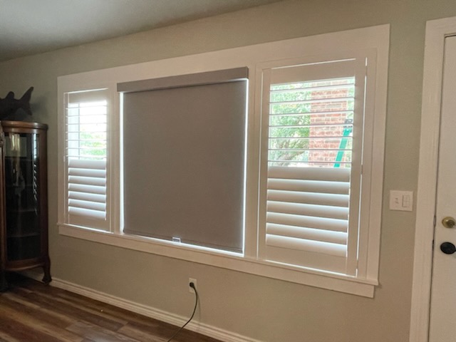 It's mixing and matching time! That's what we did for the owners of this Sperry home! To the sides, we've got beautiful Shutters, and the center features a Roller Shade!