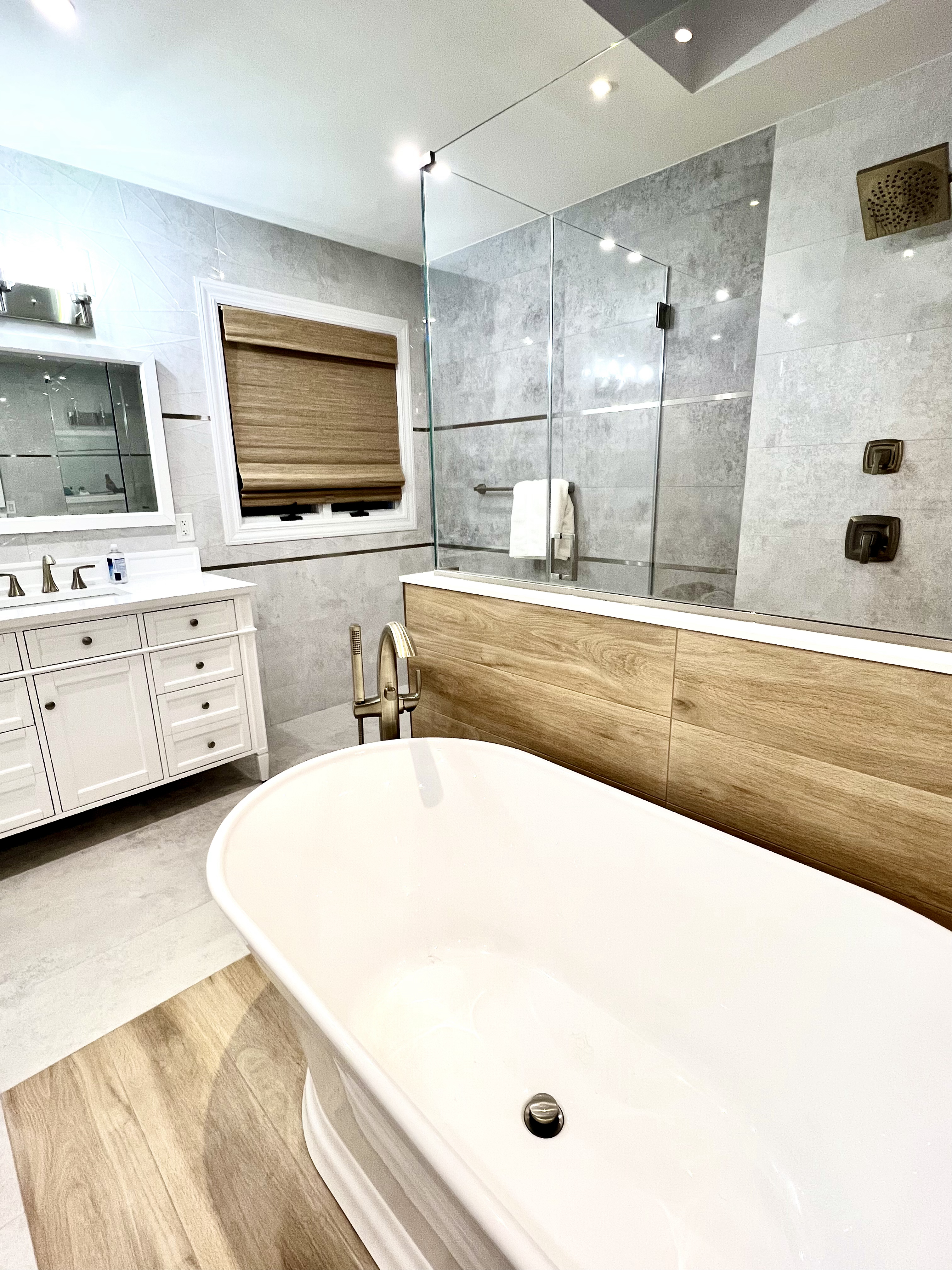 Woven Woods go along perfectly with the wood accents in this Master Bathroom in Colts Neck, NJ