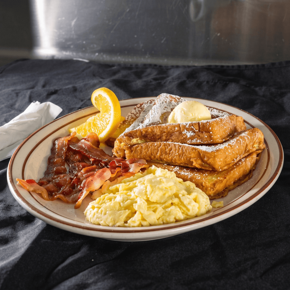 3 French Toast, 4 Bacon or Sausage & 3 Eggs