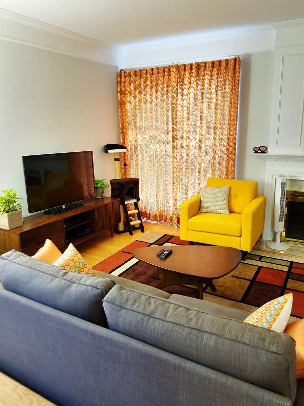 It's so much fun to decorate with splashes of bright colors! If you want ideas, you'll love this living room! Our Drapes add an awesome orange transition to this Alexandria home's reds and yellows!  BudgetBlindsArlingtonAlexandria  CustomDraperies  AlexandriaVA  FreeConsultation  WindowWednesday