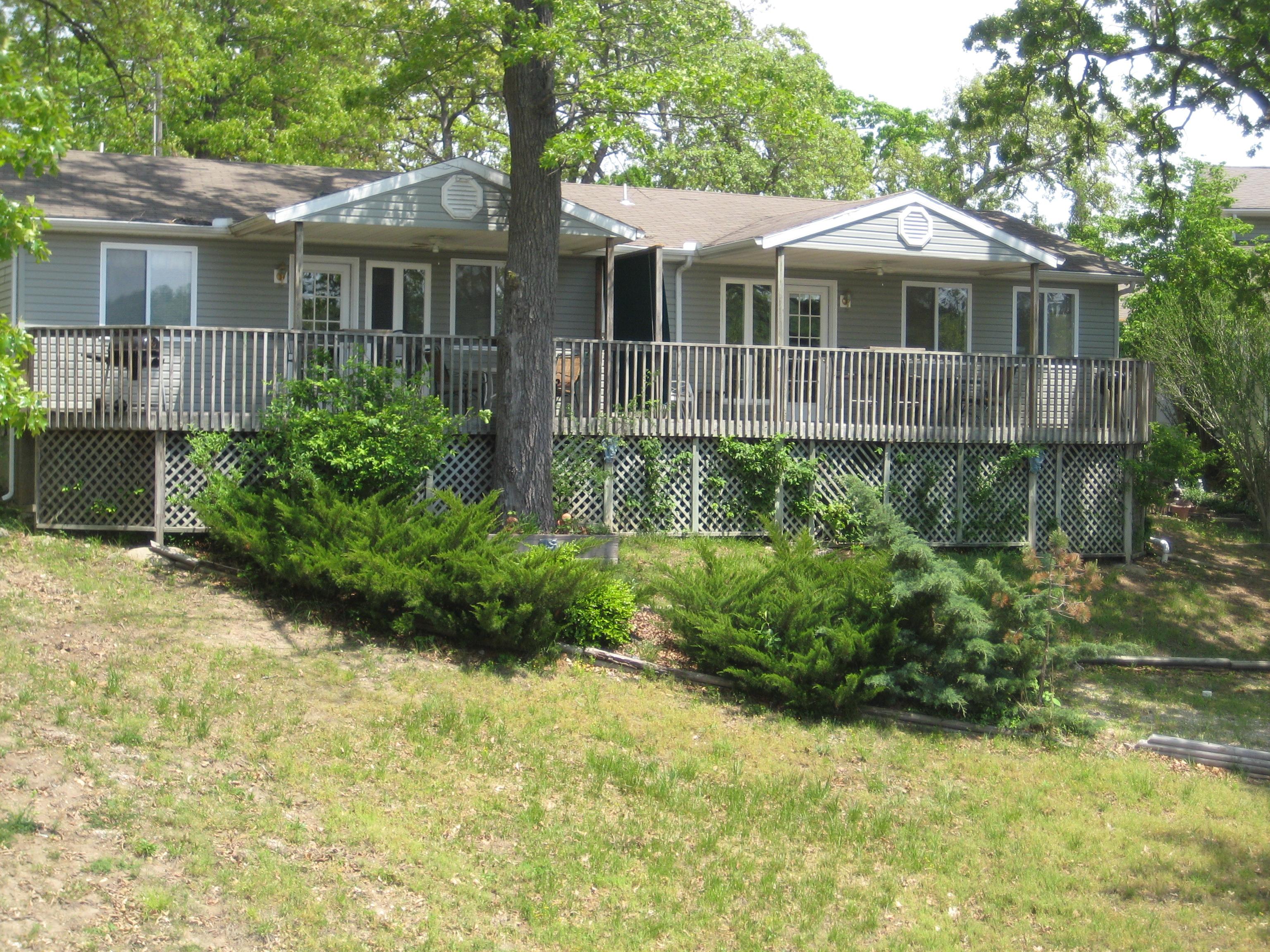 Two 1 BR ! Bath units completely contained--full kitchens, separated by utility room, Great deck over looking the Lake. A short walk to dock for swimming , fishing or hanging out.