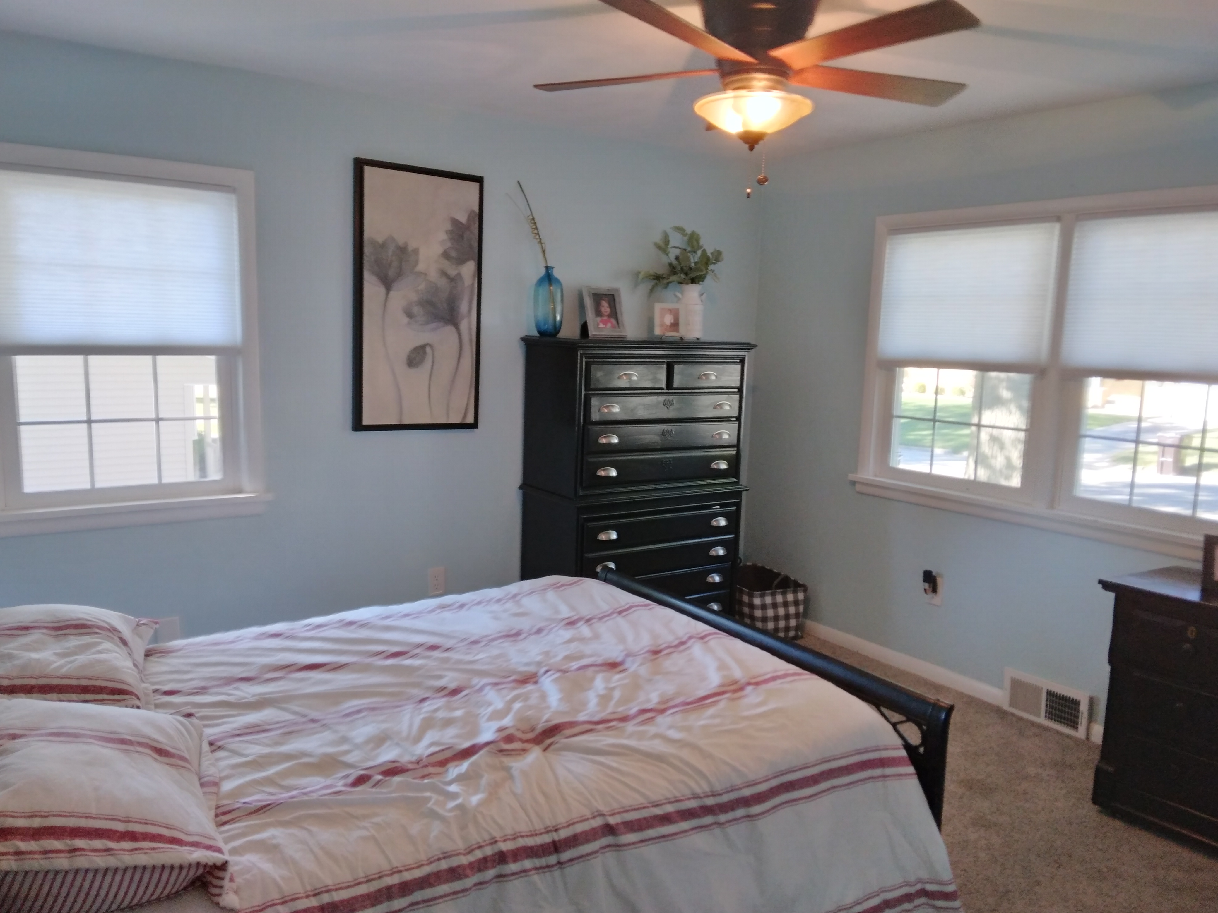 White, cordless, light-filtering cellular (honeycomb) shades in Springfield Illinois bedroom.  BudgetBlinds  WindowCoverings  Shades  CellularShades  SpringfieldIllinois